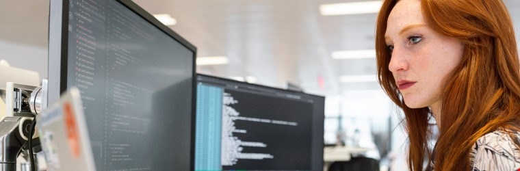 Woman working on computers