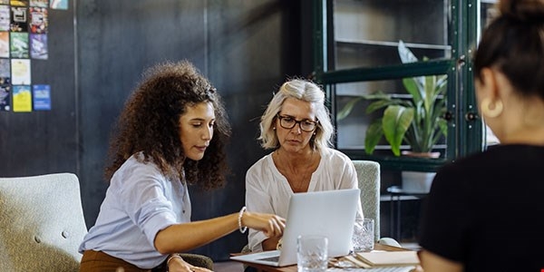 two people on a computer