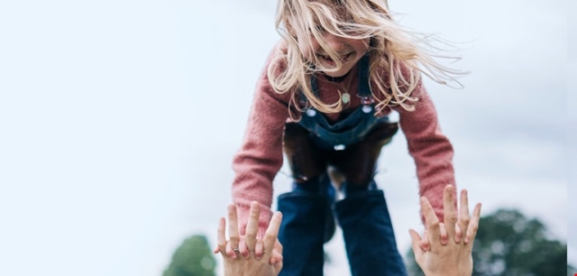 little girl held up in the air
