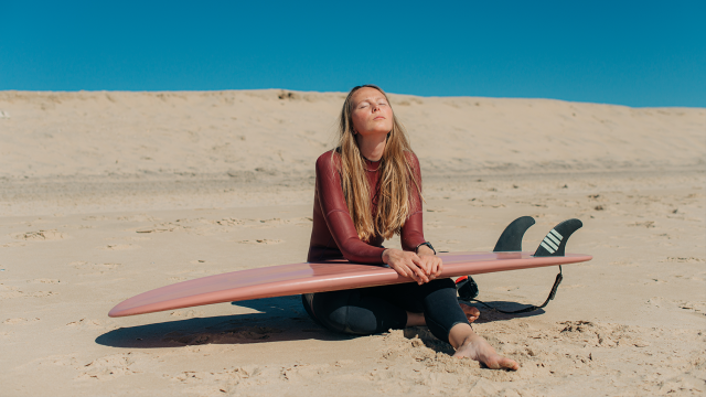 Woman surfer on the beach