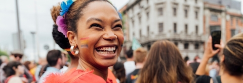 Young woman smiling Pride event 