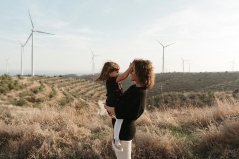 Mother and child with wind turbines 