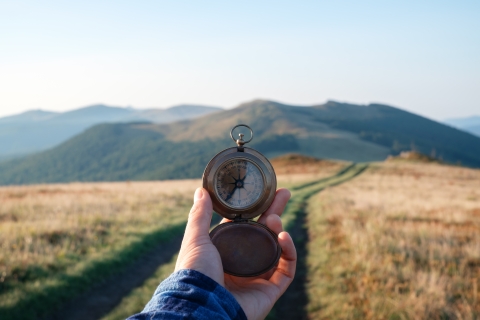 Man with compass in hand